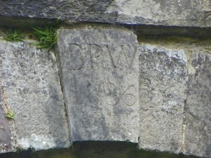 Releagh Bridge's key stone bearing the construction year 1836 and the names of two stone masons.