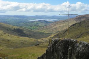 The metal cross at Priest's Leap and the view along Borlin Valley towards Bantry Bay.
