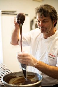 Benoit Lorge filling liquid chocolate into a piping bag a